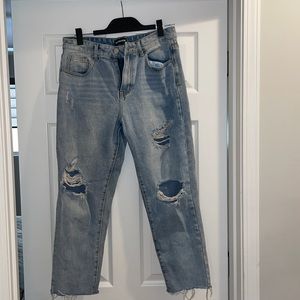 Light blue wash distressed jeans